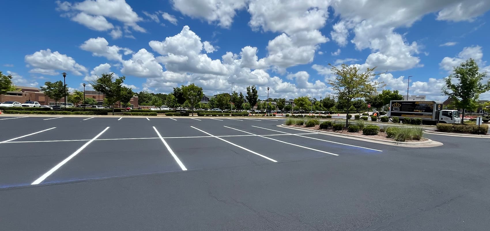 Shopping center parking lot after resurfacing and re-striping