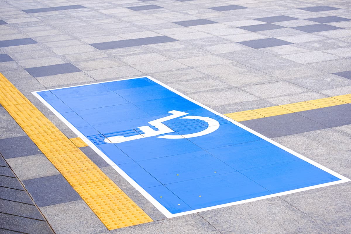 ADA compliant parking bay with access aisle and signage