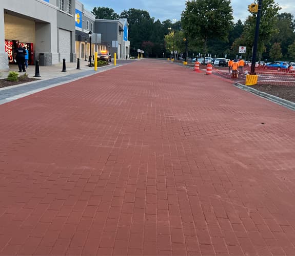 Stamped and colored decorative asphalt walkway at a retail entrance
