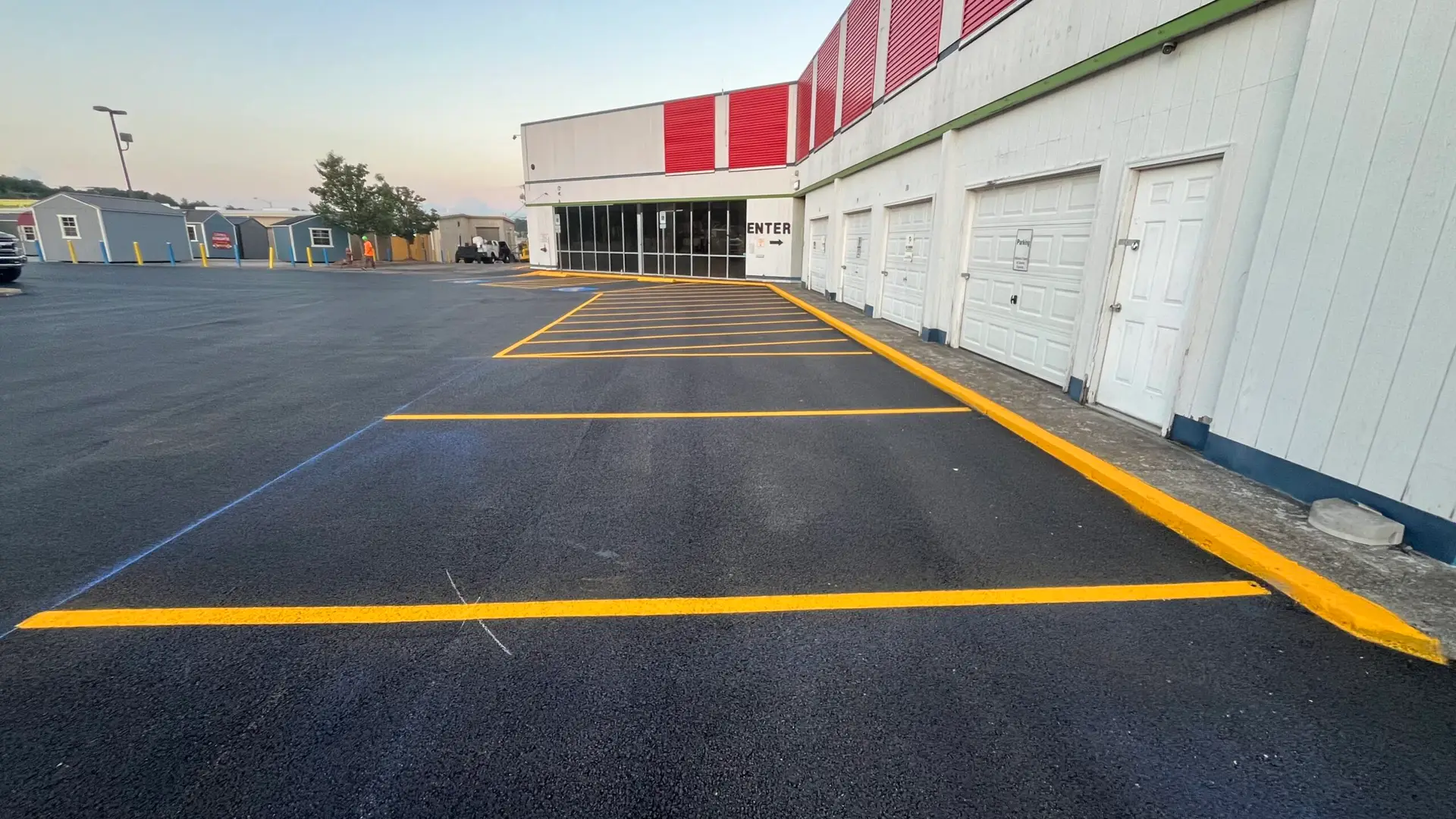 Fresh parking stall markings applied after paving