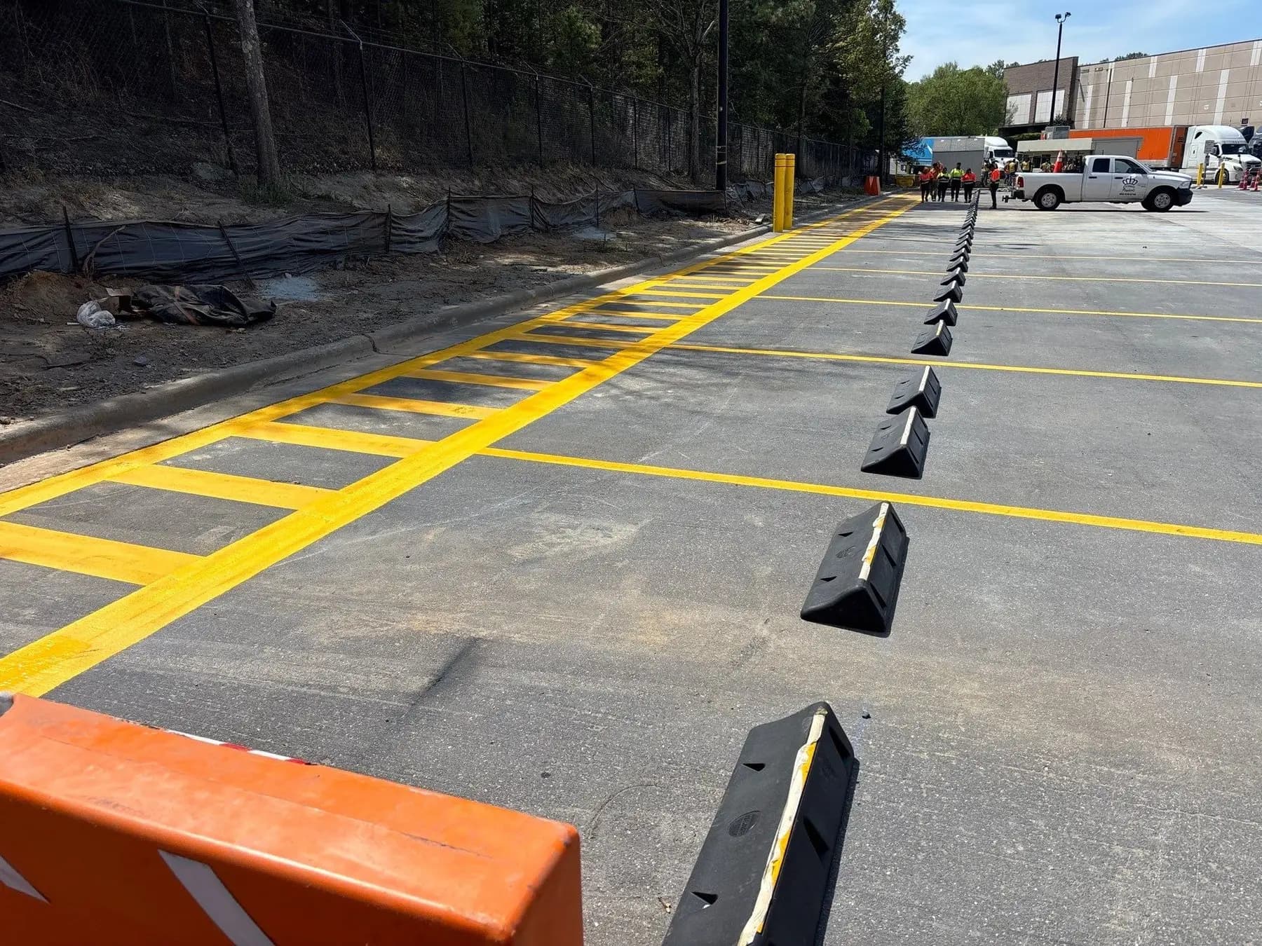 Wheel stops and traffic markings at an Amazon distribution center