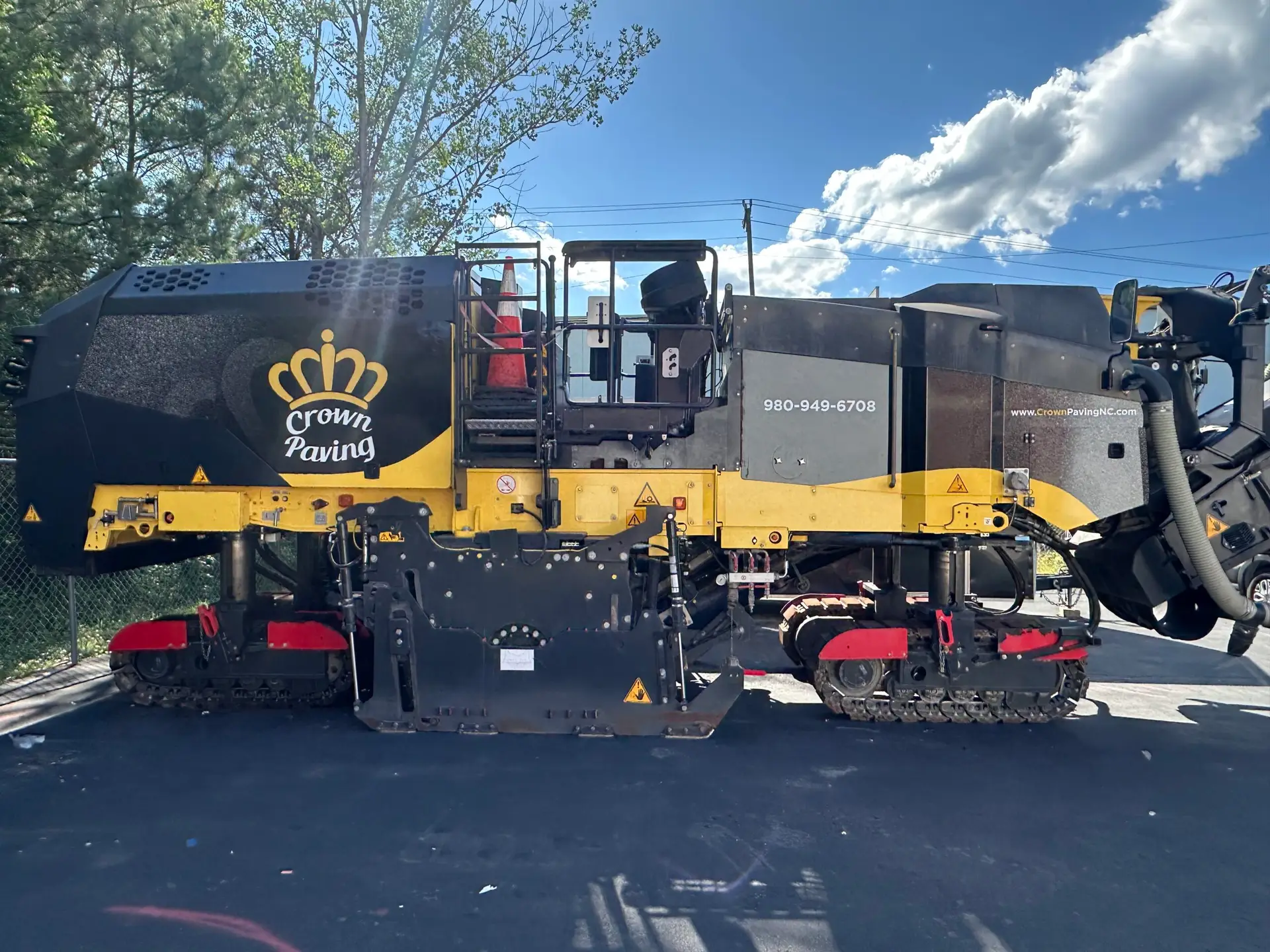 A Crown Paving milling machine staged on a commercial lot in Charlotte NC