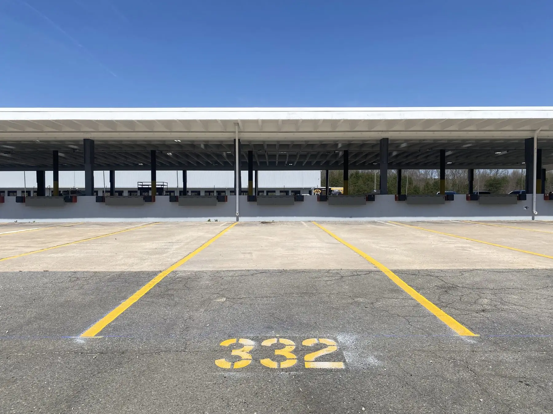 Fresh stall and lane markings across a freight terminal lot