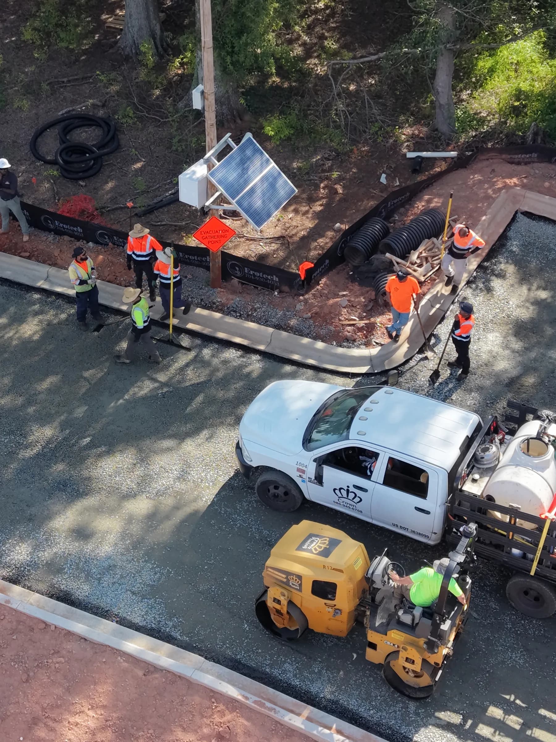 Crown Paving crew and rollers compacting a freshly laid asphalt mat