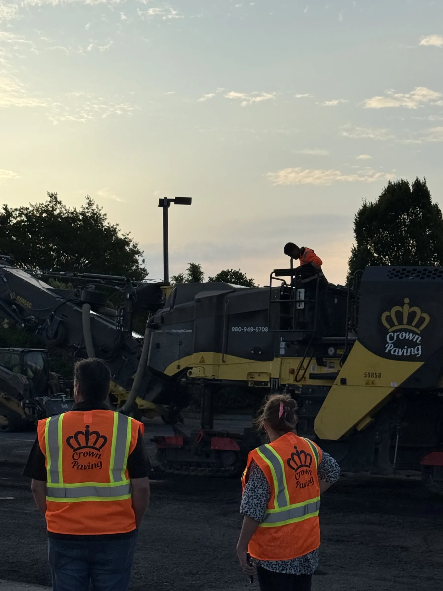 Crown Paving crew watching the milling machine work at first light