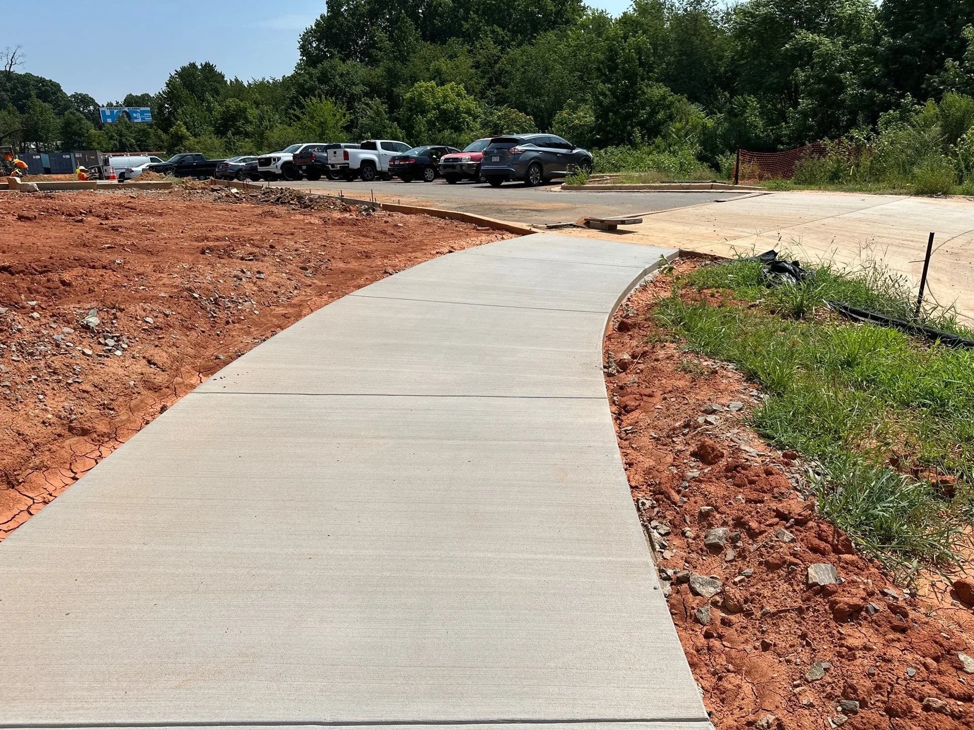 Crown Paving crew forming and pouring a concrete curb