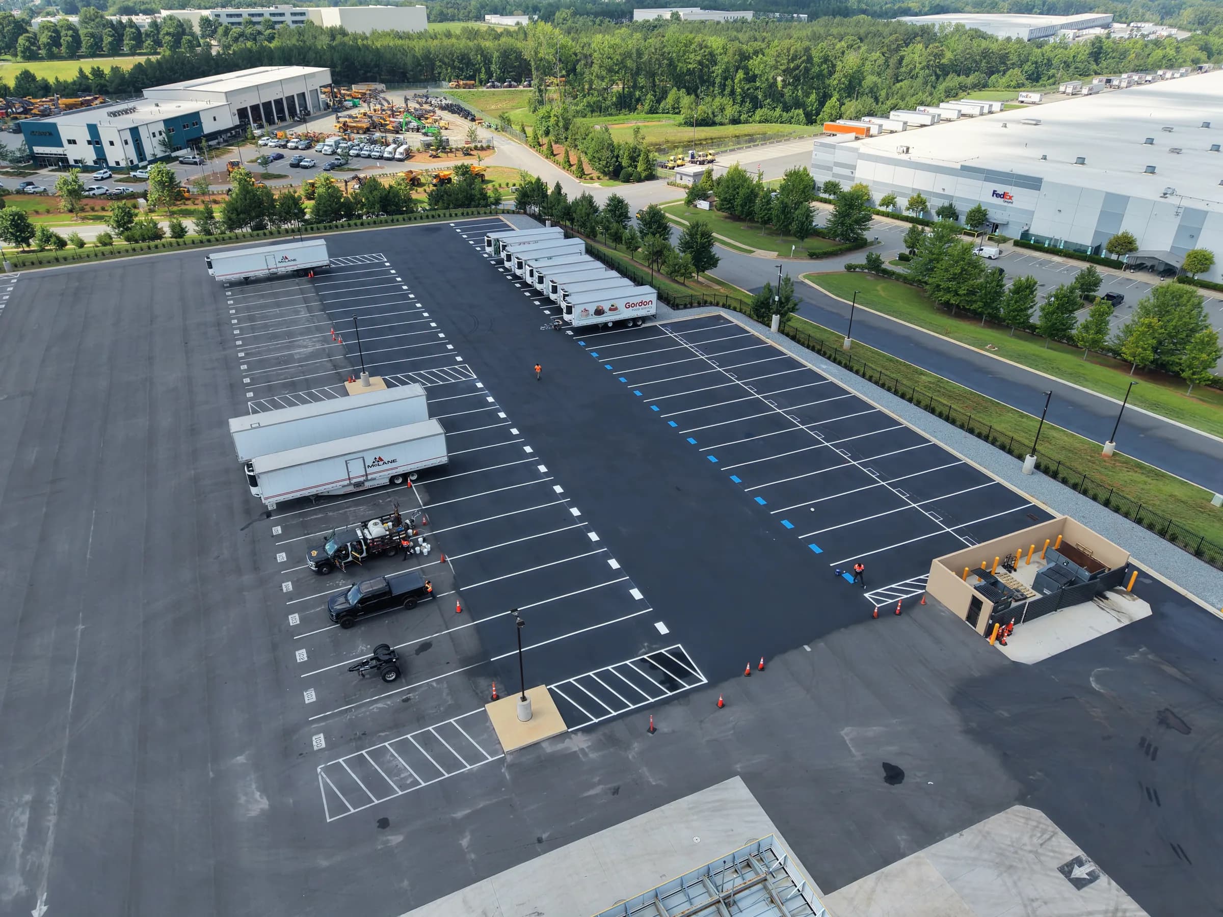 Trailers parked on freshly striped trailer stalls, seen from above
